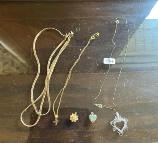 Auction lot featuring necklaces and pendants